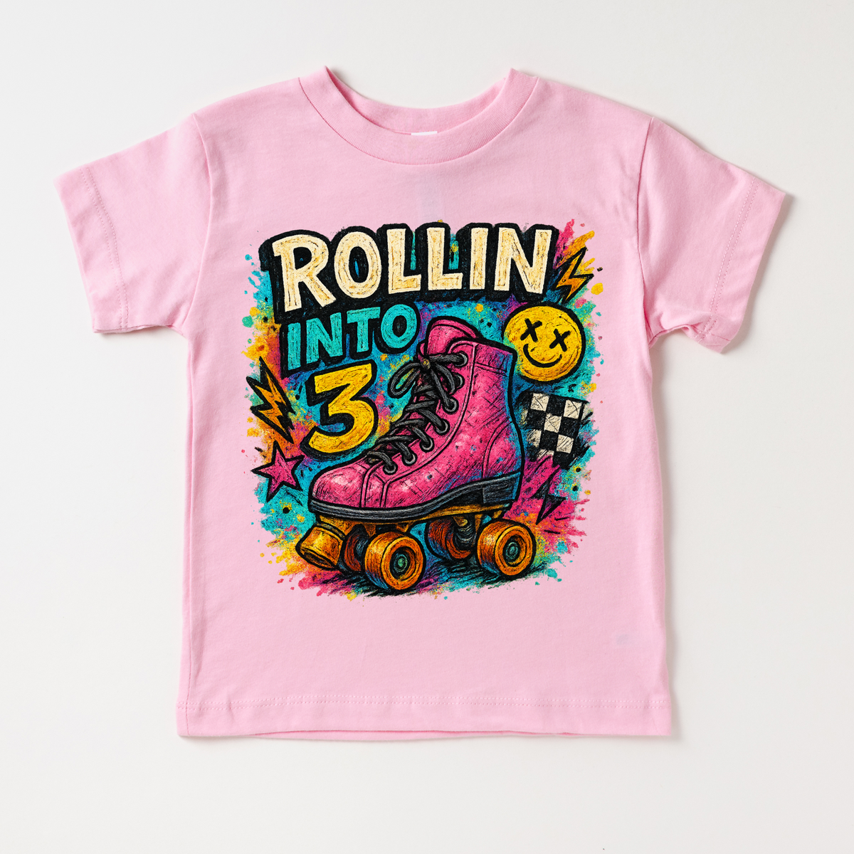 Rollin Into 3 Roller Skating Birthday design on a pink garment.