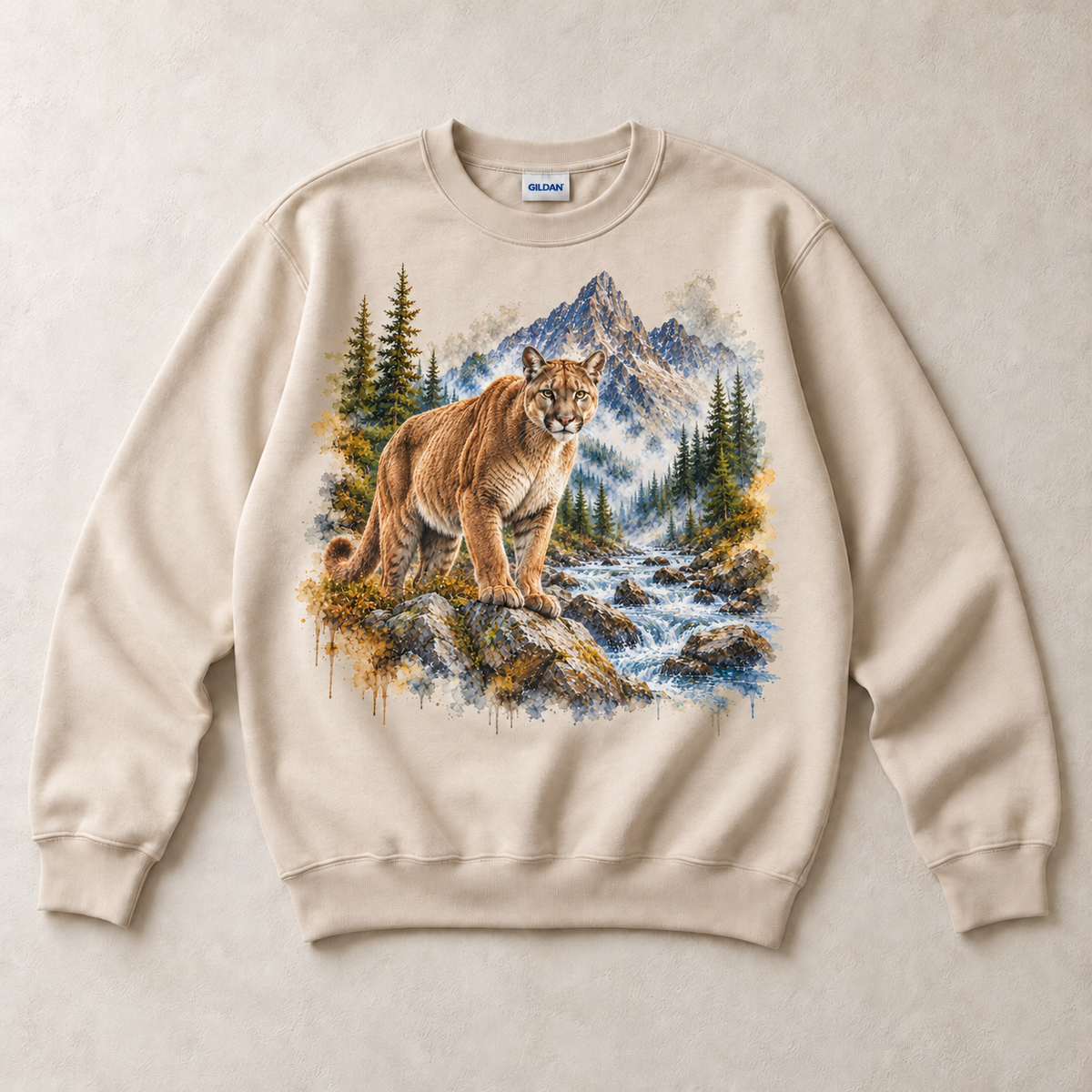 Sand Gildan crewneck sweatshirt with Cougar Mountain graphic, front flat lay