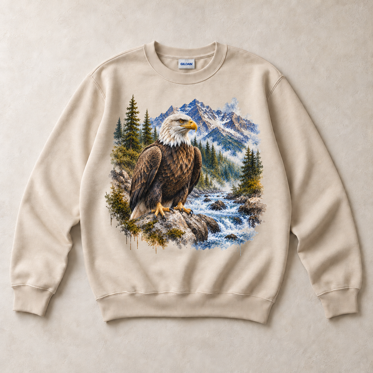 Sand Gildan crewneck sweatshirt with Bald Eagle Mountain graphic, front flat lay