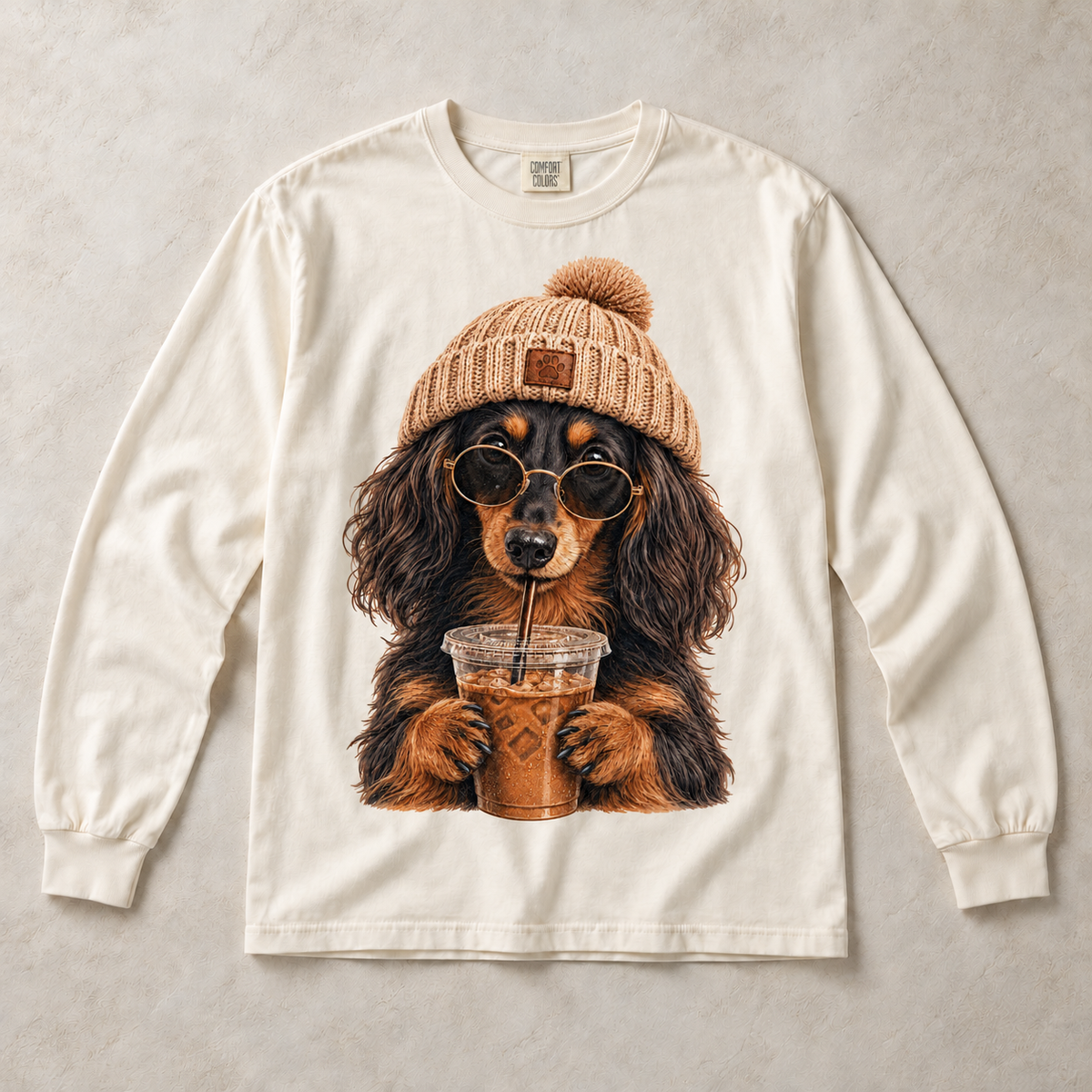 Ivory Comfort Colors long-sleeve T-shirt with Long Haired Dachshund Iced Coffee graphic, front flat lay