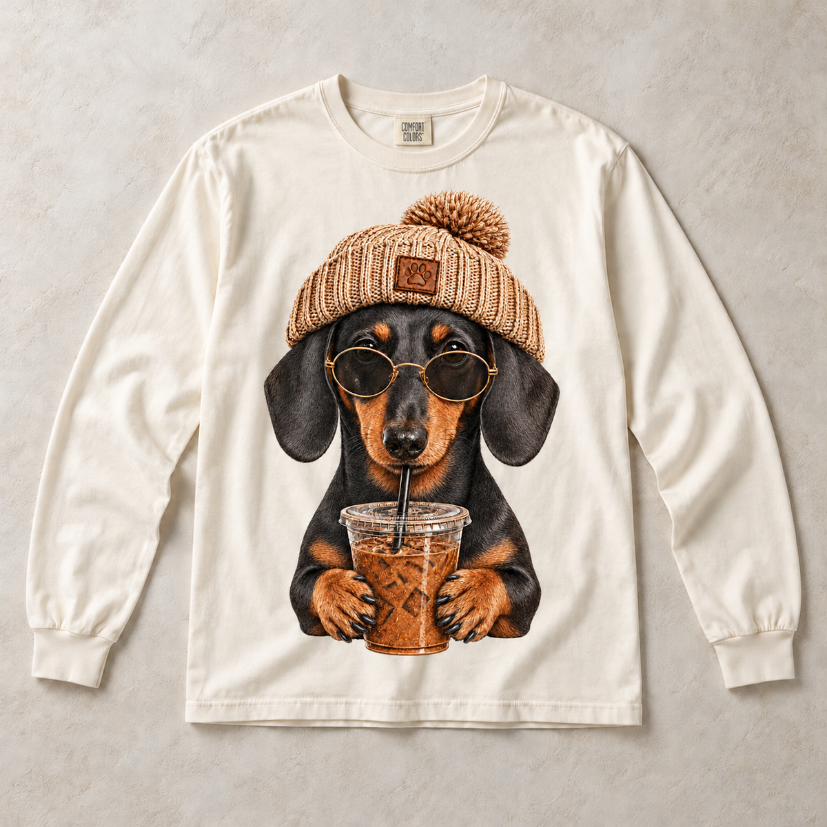 Ivory Comfort Colors long-sleeve T-shirt with Dachshund Iced Coffee graphic, front flat lay