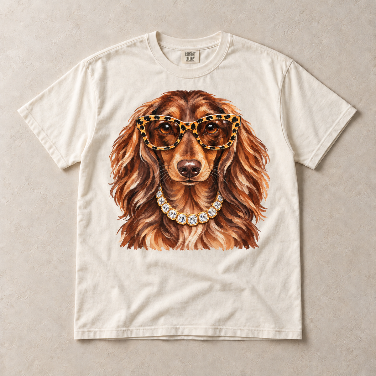 Ivory Comfort Colors short-sleeve T-shirt with Dachshund Leopard Glasses graphic, front flat lay
