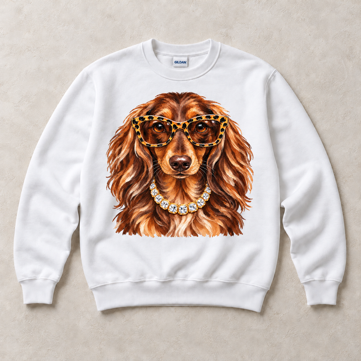 White Gildan crewneck sweatshirt with Dachshund Leopard Glasses graphic, front flat lay
