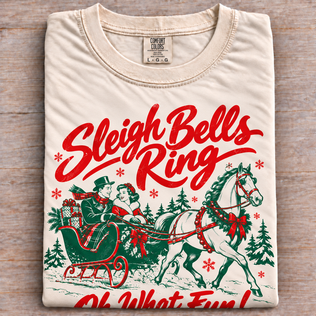 Natural Comfort Colors Sleigh Bells Ring shirt folded on wood