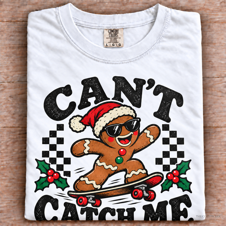 White Comfort Colors Can't Catch Me Shirt folded on wood