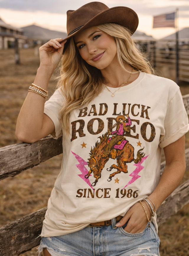 Bad Luck Rodeo Graphic Tee – Vintage Cowgirl Shirt – Western Rodeo T-Shirt – Pink Lightning Cowgirl Boutique Apparel