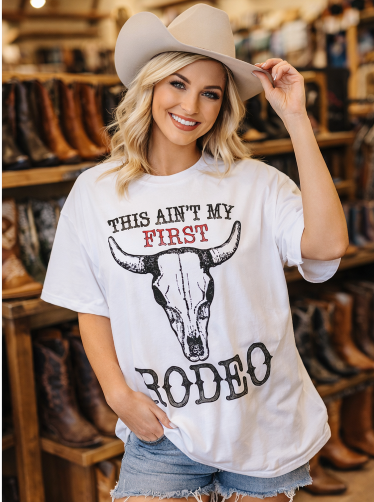This Ain’t My First Rodeo Graphic Tee – Western Cow Skull Shirt – Vintage Cowboy T-Shirt – Funny Cowgirl Boutique Apparel