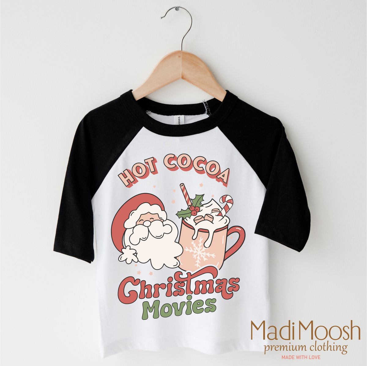 Hot Cocoa And Christmas Movies design on a raglan shirt with black sleeves.