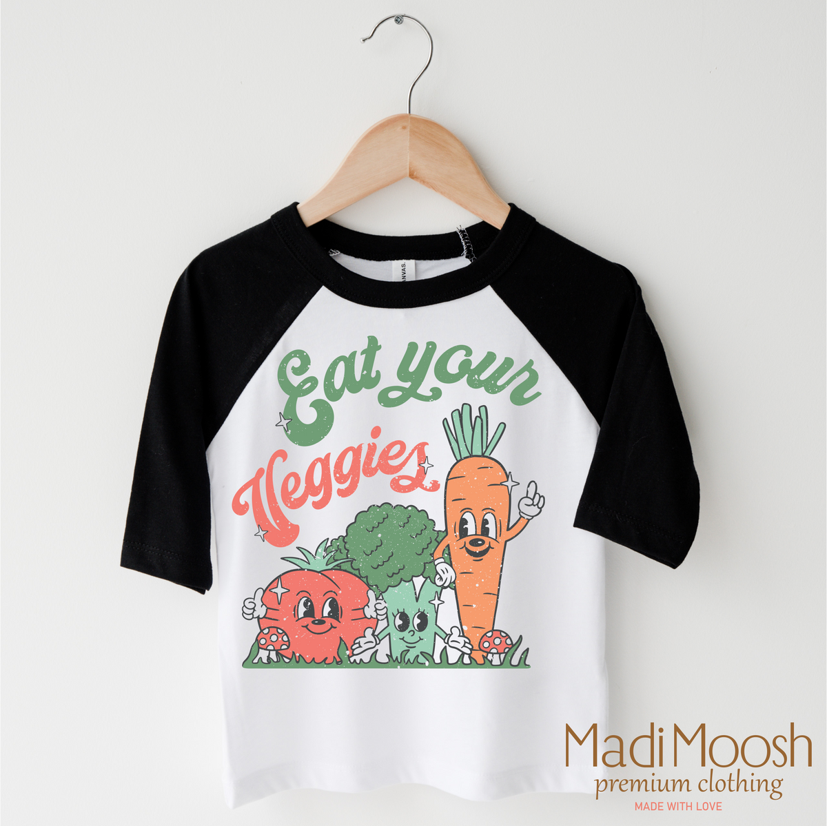 Eat Your Veggies design on a black-accented shirt.