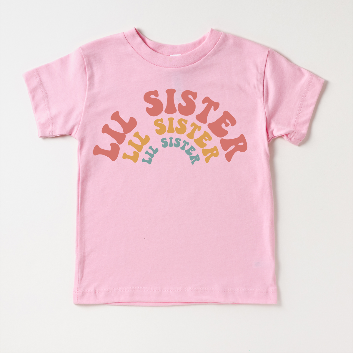 Retro Lil Sis Sister Siblings Family design on a pink garment.