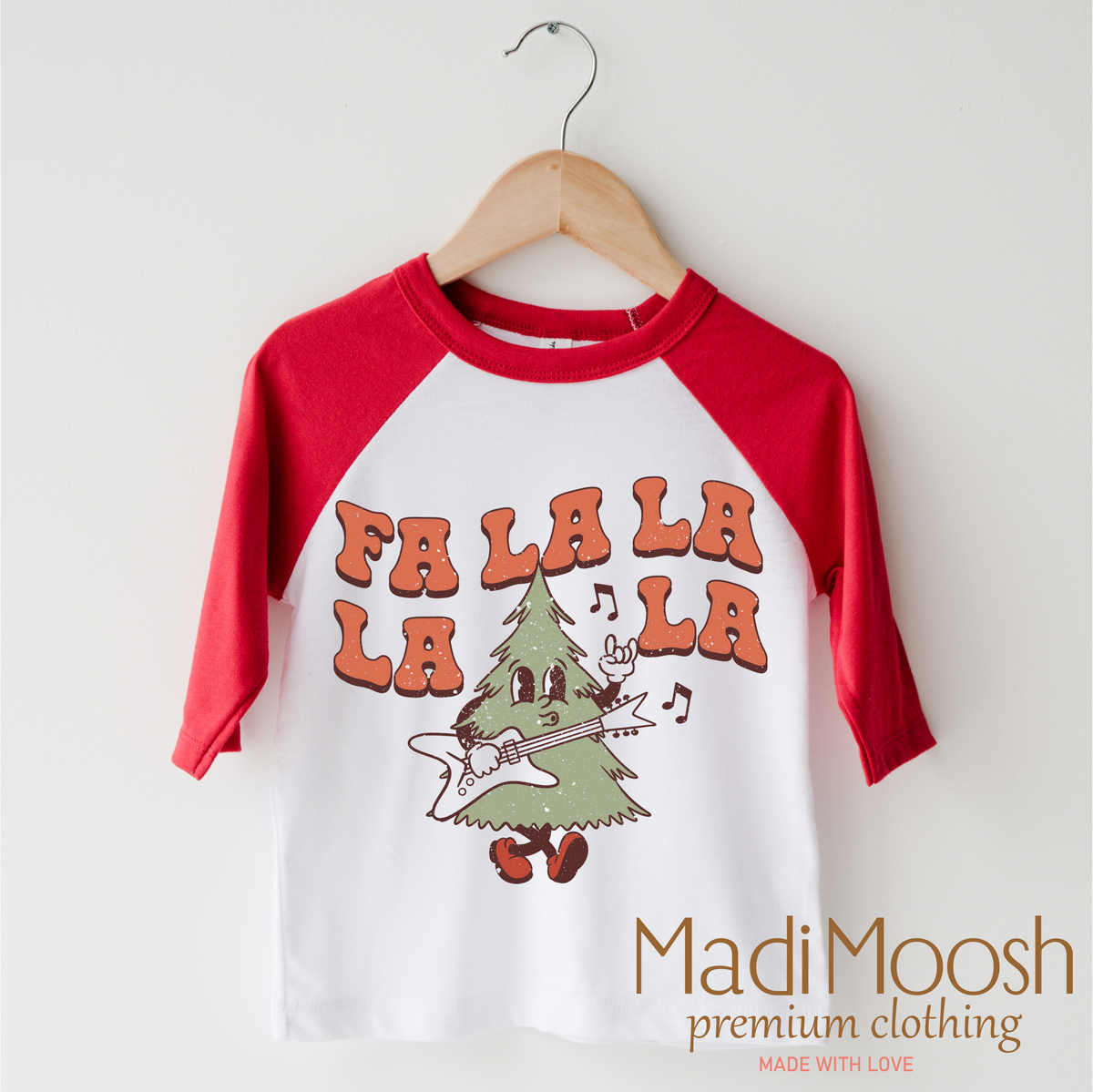 Fa La La La La Christmas design on a red-accented shirt.