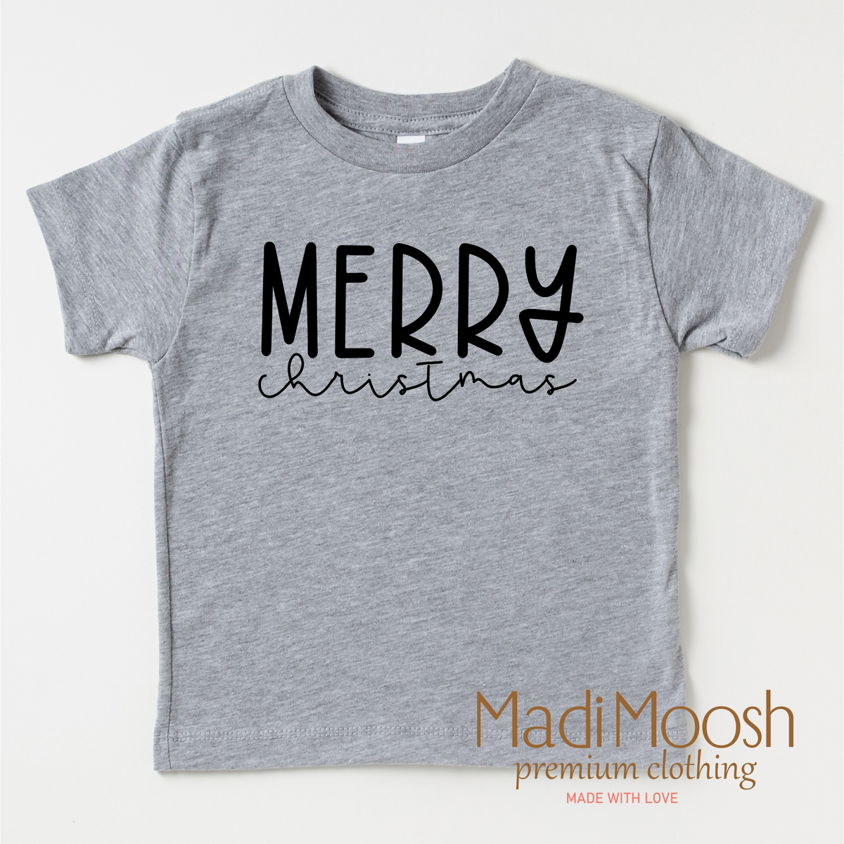 Classic Merry Christmas design on a gray garment.