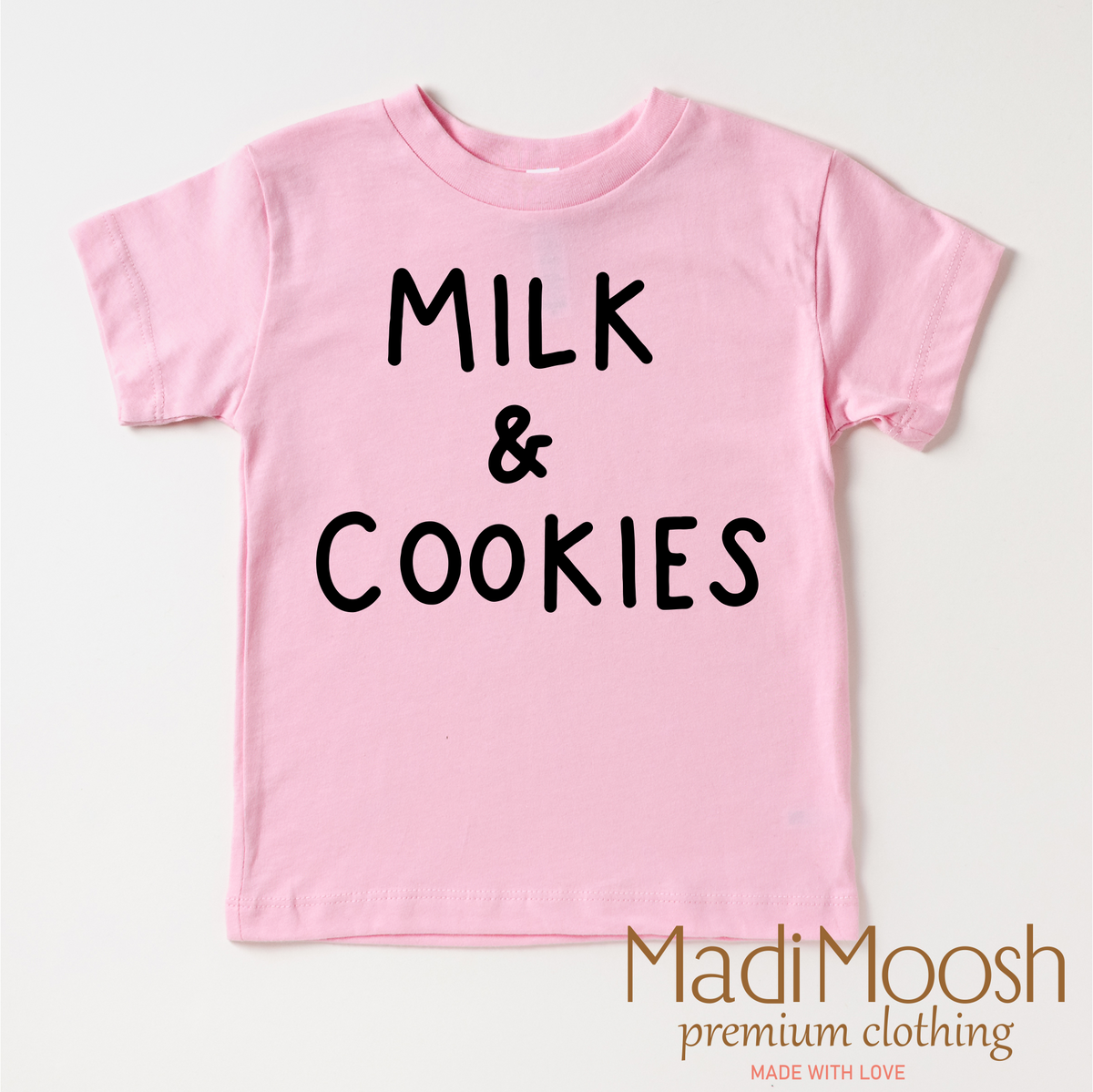 Milk And Cookies Classic Christmas design on a pink garment.