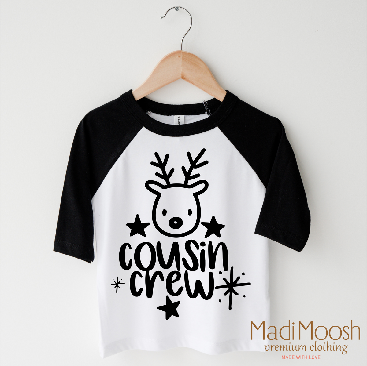 Cousin Crew Christmas design on a black-accented shirt.