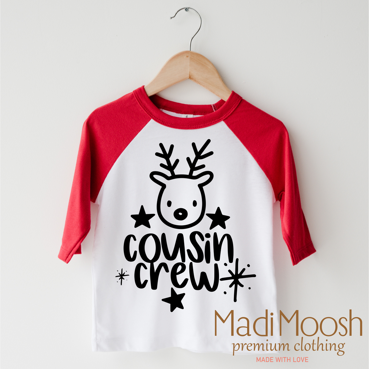 Cousin Crew Christmas design on a red-accented shirt.