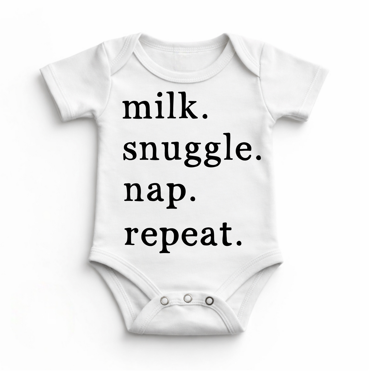 Milk Snuggle Nap Repeat Bodysuit design on a white garment.