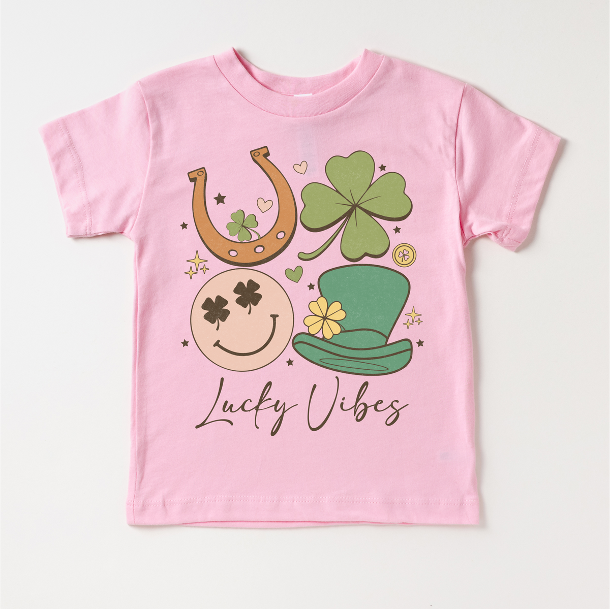 Lucky Vibes St. Patrick's Day design on a pink garment.