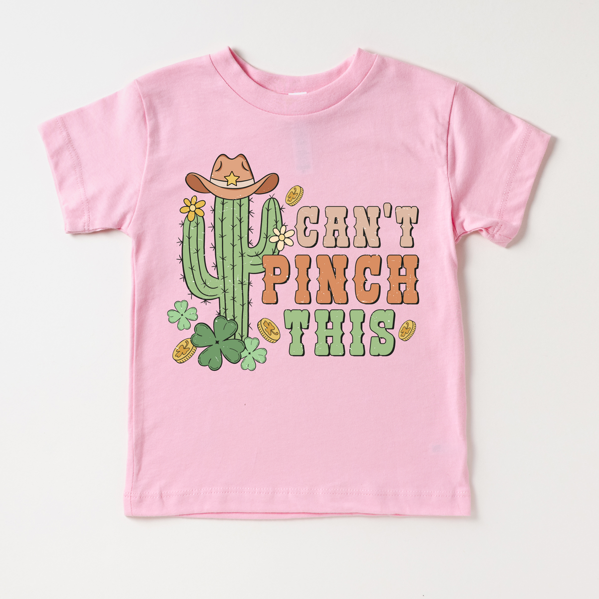 Western St. Patrick's Day design on a pink garment.