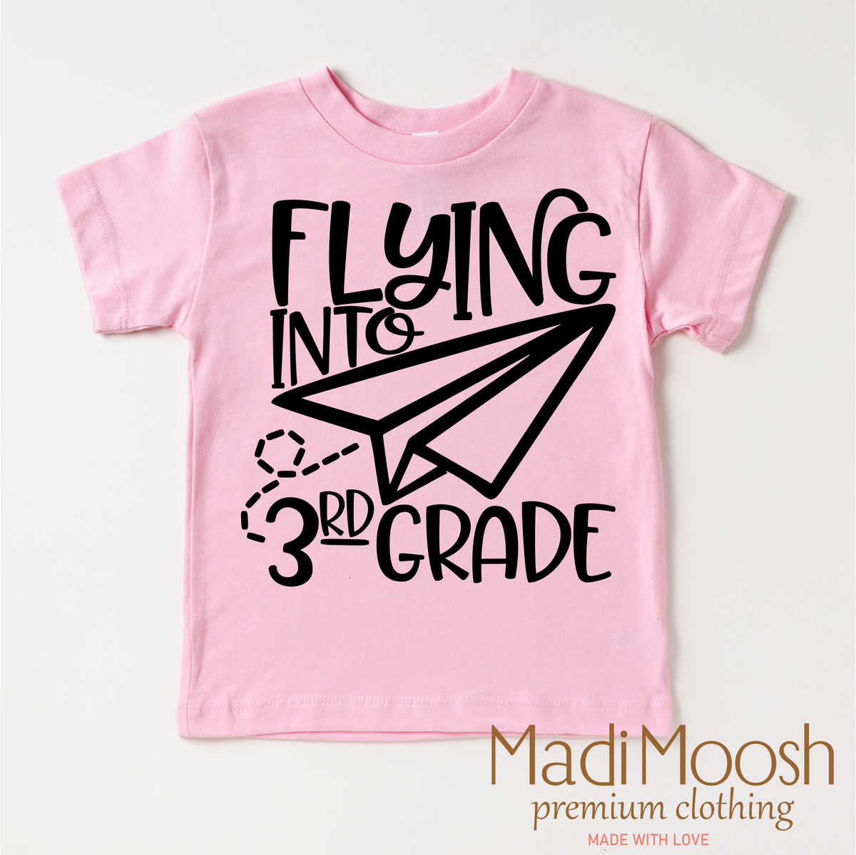Flying Into 3rd Grade Back To School design on a pink garment.