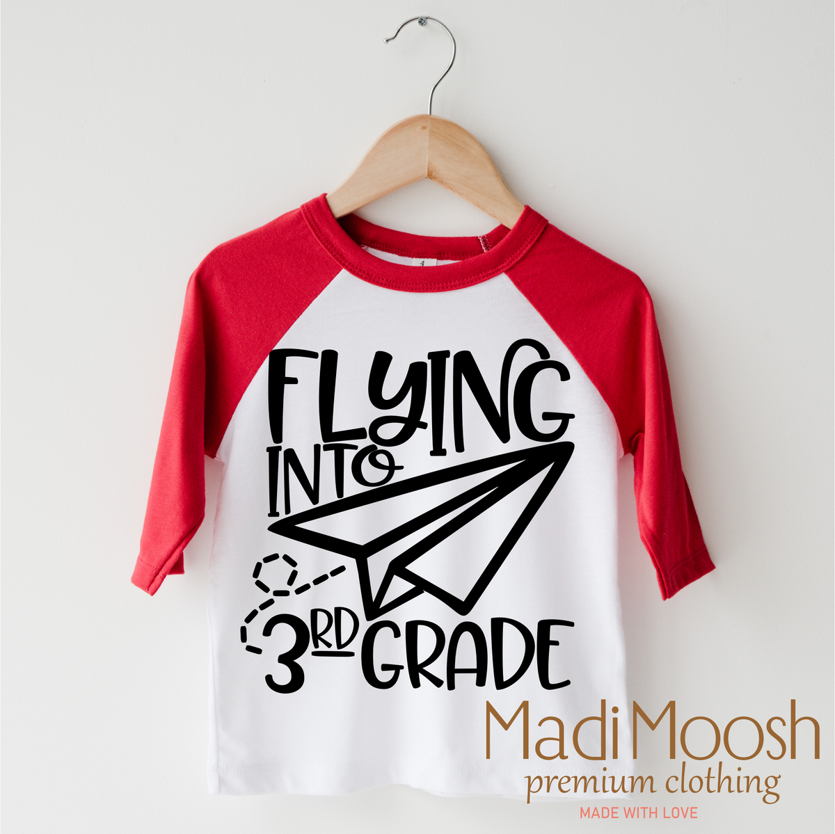 Flying Into 3rd Grade Back To School design on a red-accented shirt.