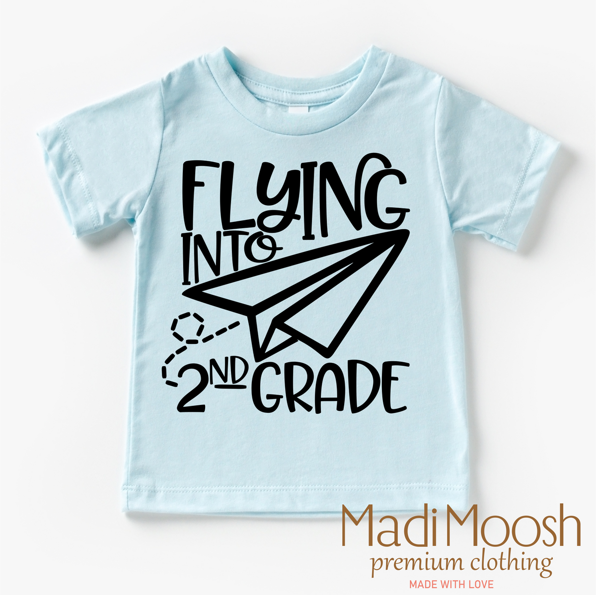Flying Into 2nd Grade Back To School design on a blue garment.