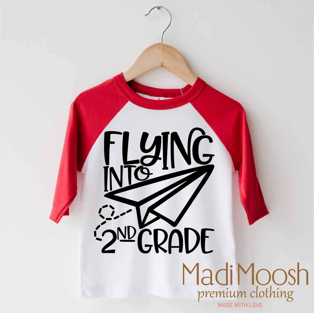 Flying Into 2nd Grade Back To School design on a red-accented shirt.