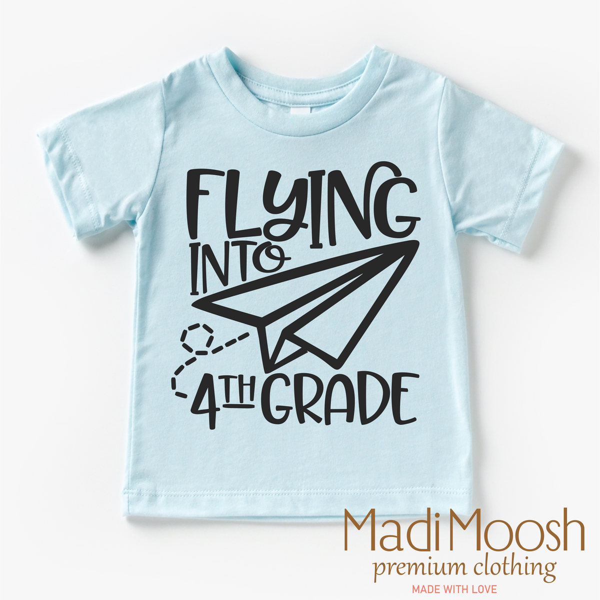 Flying Into 4th Grade Back To School design on a blue garment.