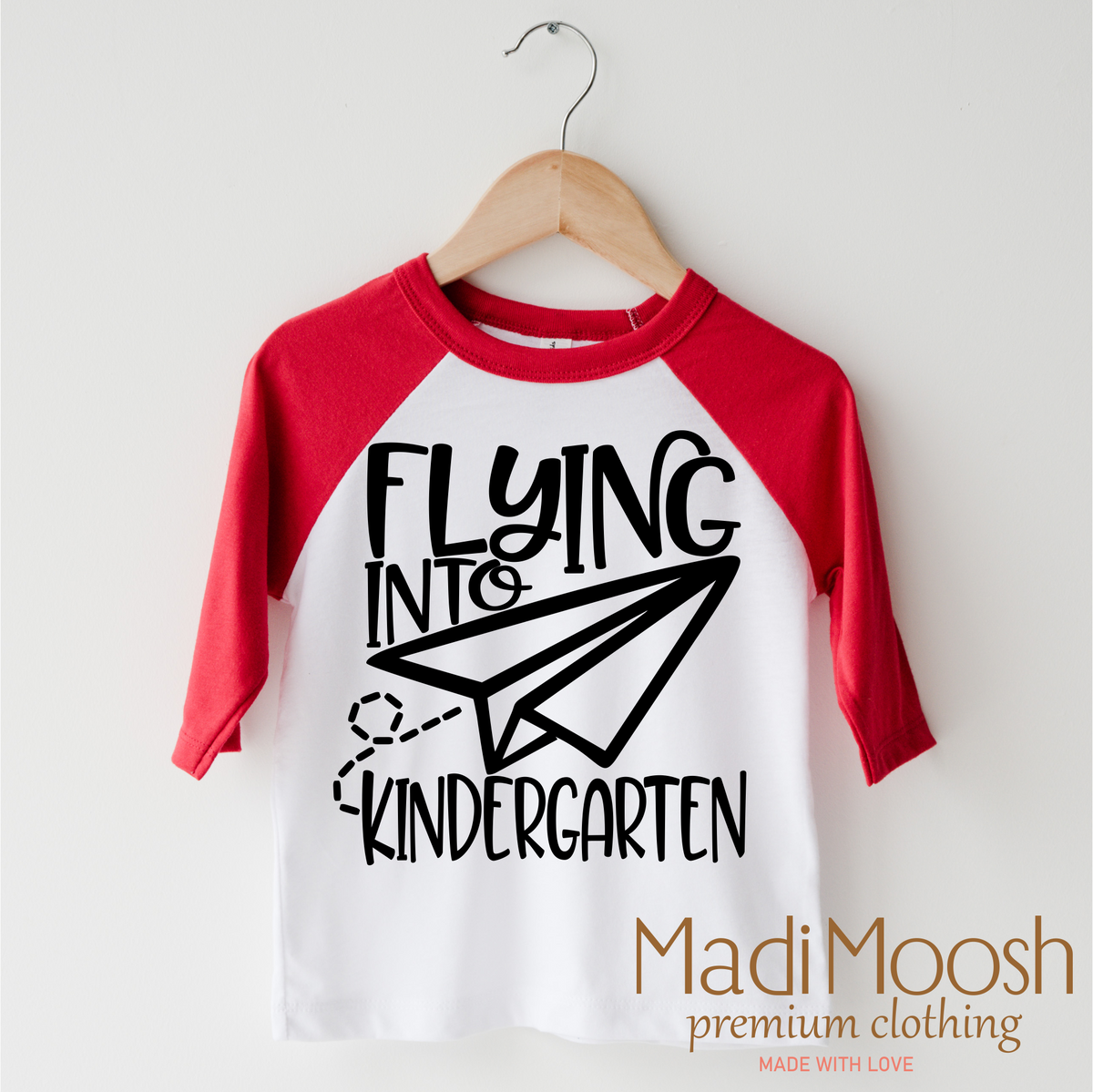 Flying Into Kindergarten Back To School design on a red-accented shirt.