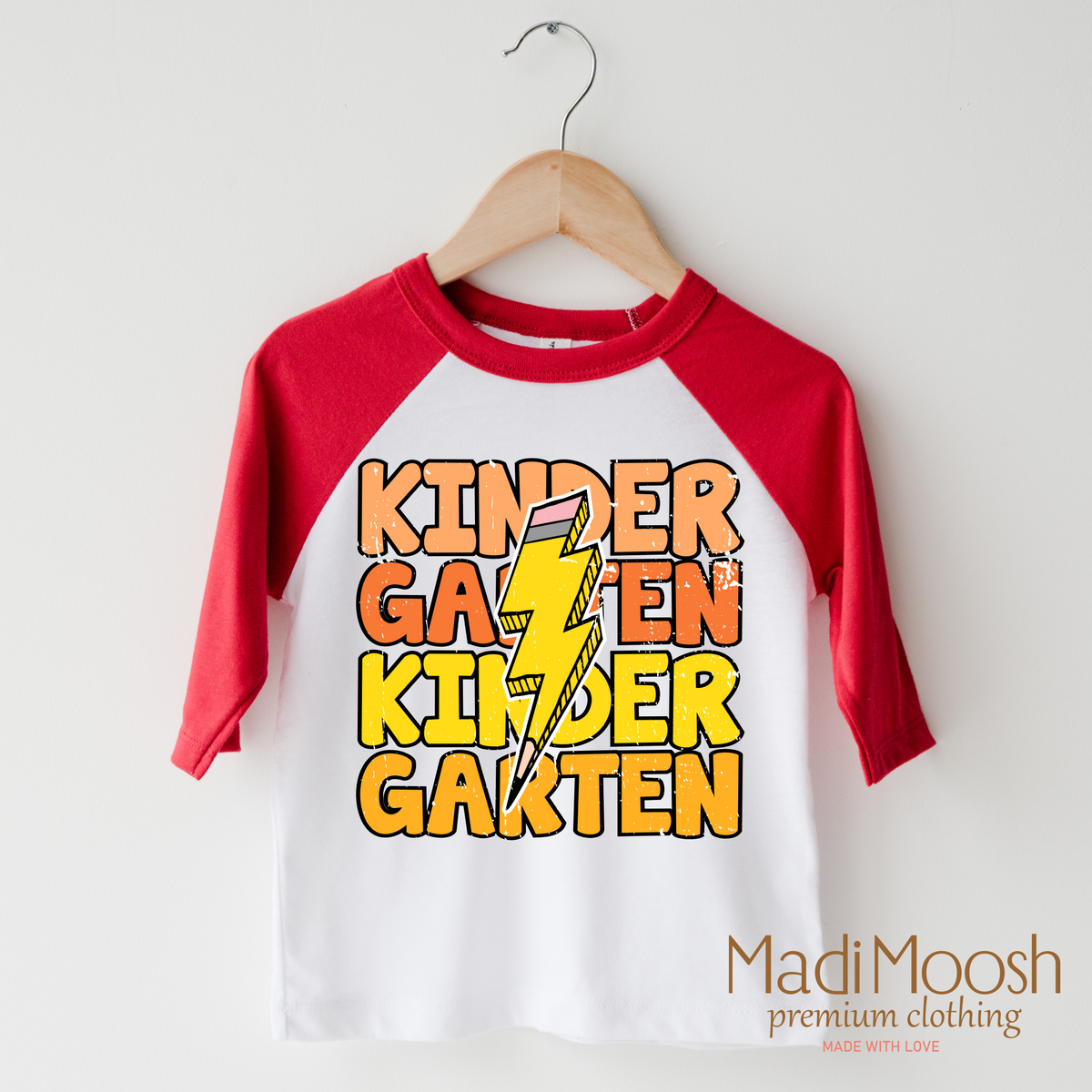 Kindergarten Lightning Bolt design on a raglan shirt with red sleeves.
