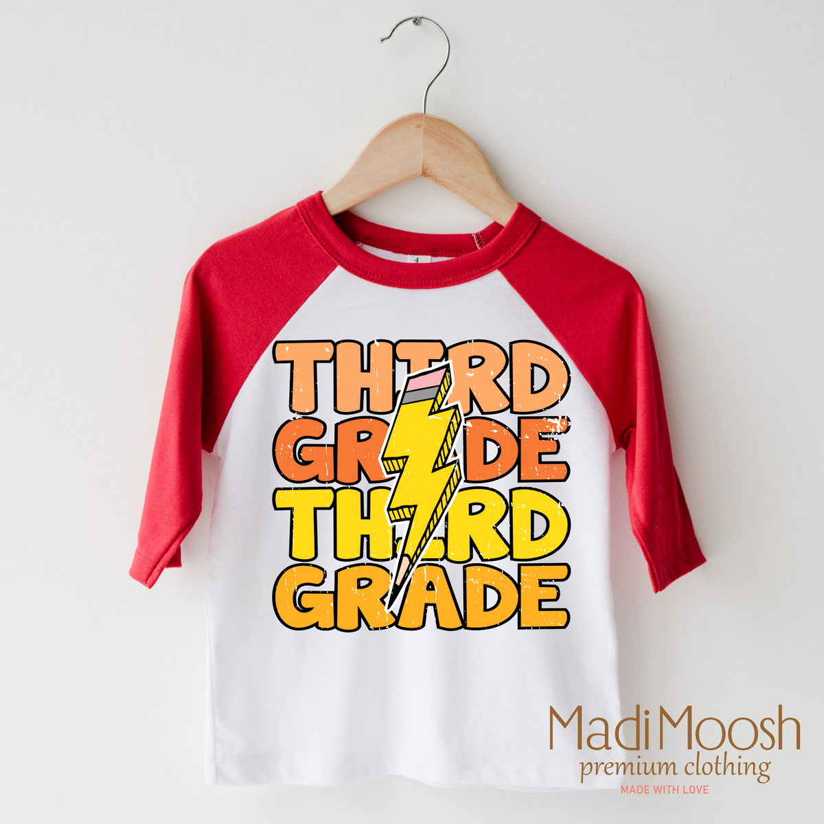 Third Grade Lightning Bolt design on a raglan shirt with red sleeves.