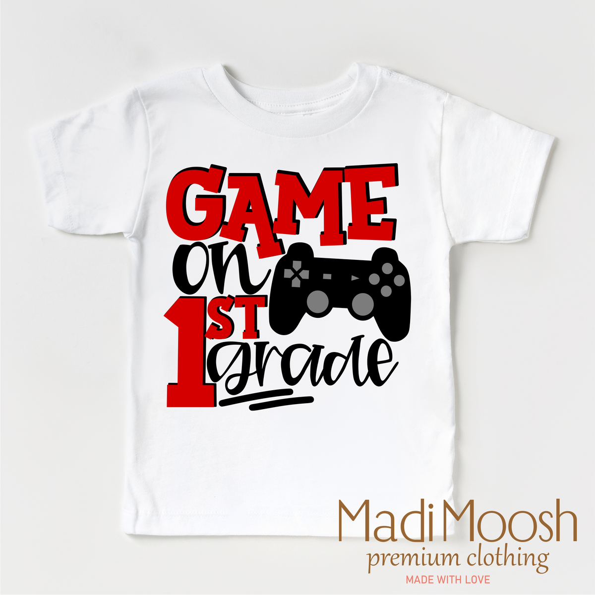 Game On First Grade Back To School design on a white short sleeve T-shirt.