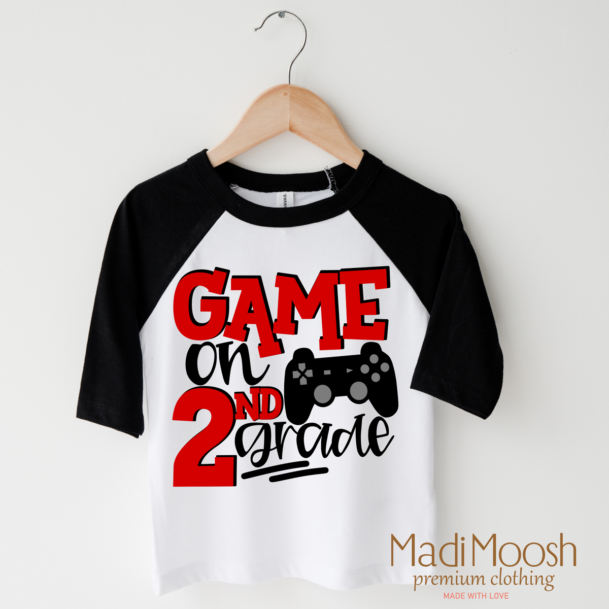 Game On Second Grade Back To School design on a raglan shirt with black sleeves.