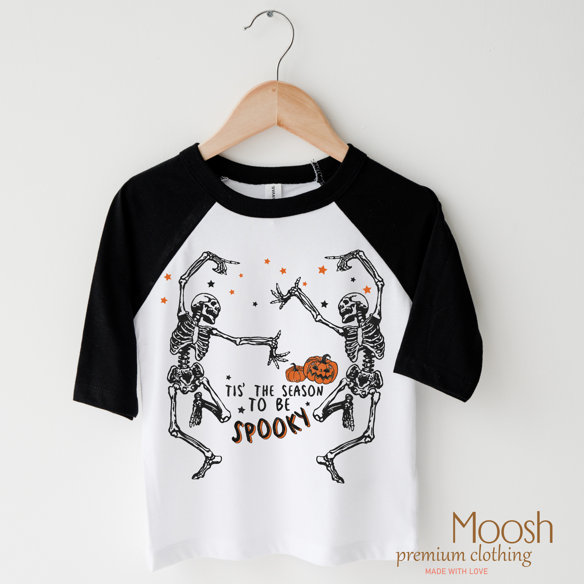 Tis The Season To Be Spooky design on a raglan shirt with black sleeves.
