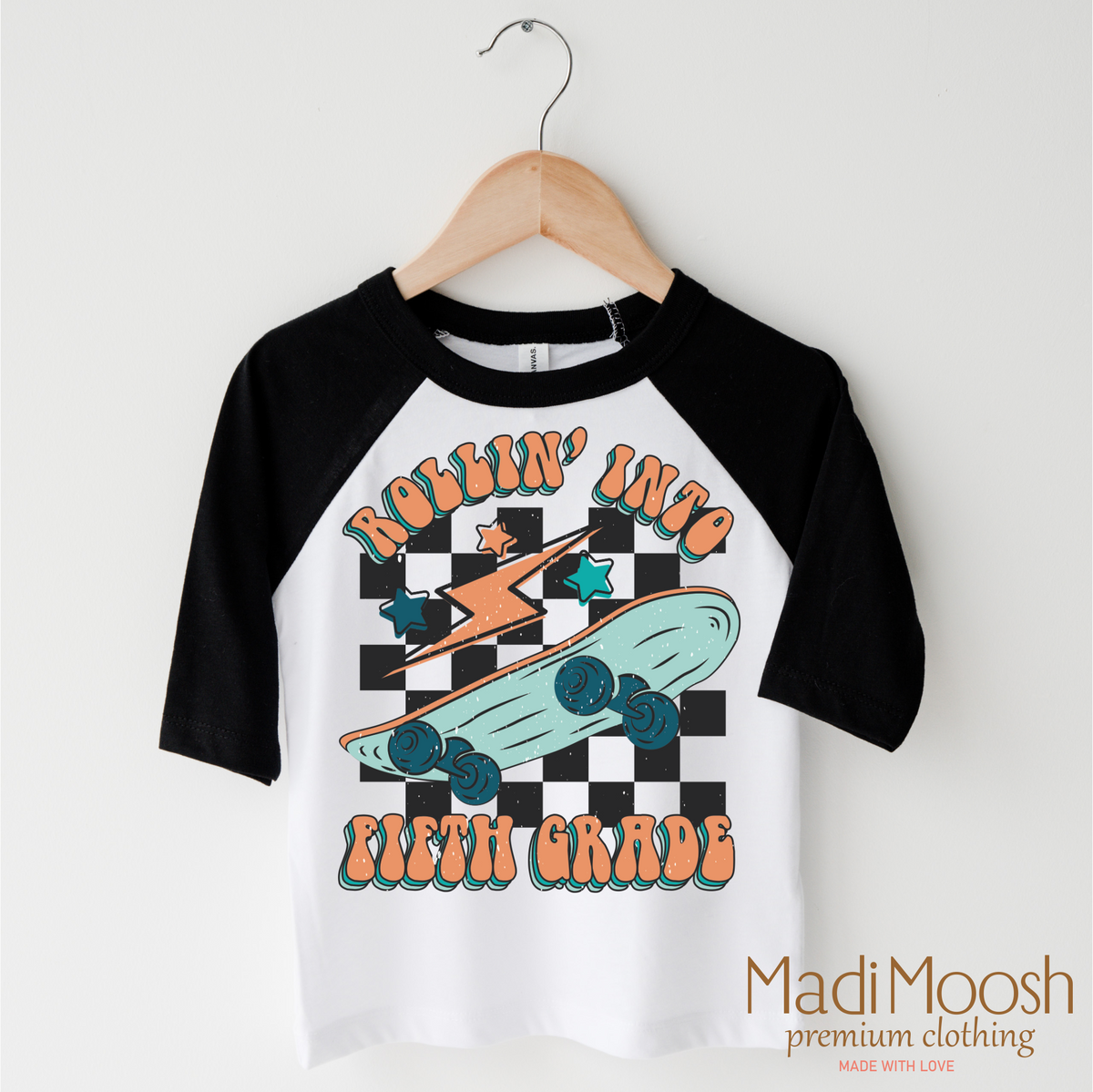 Rollin' Into 5th Back To School design on a black-accented shirt.