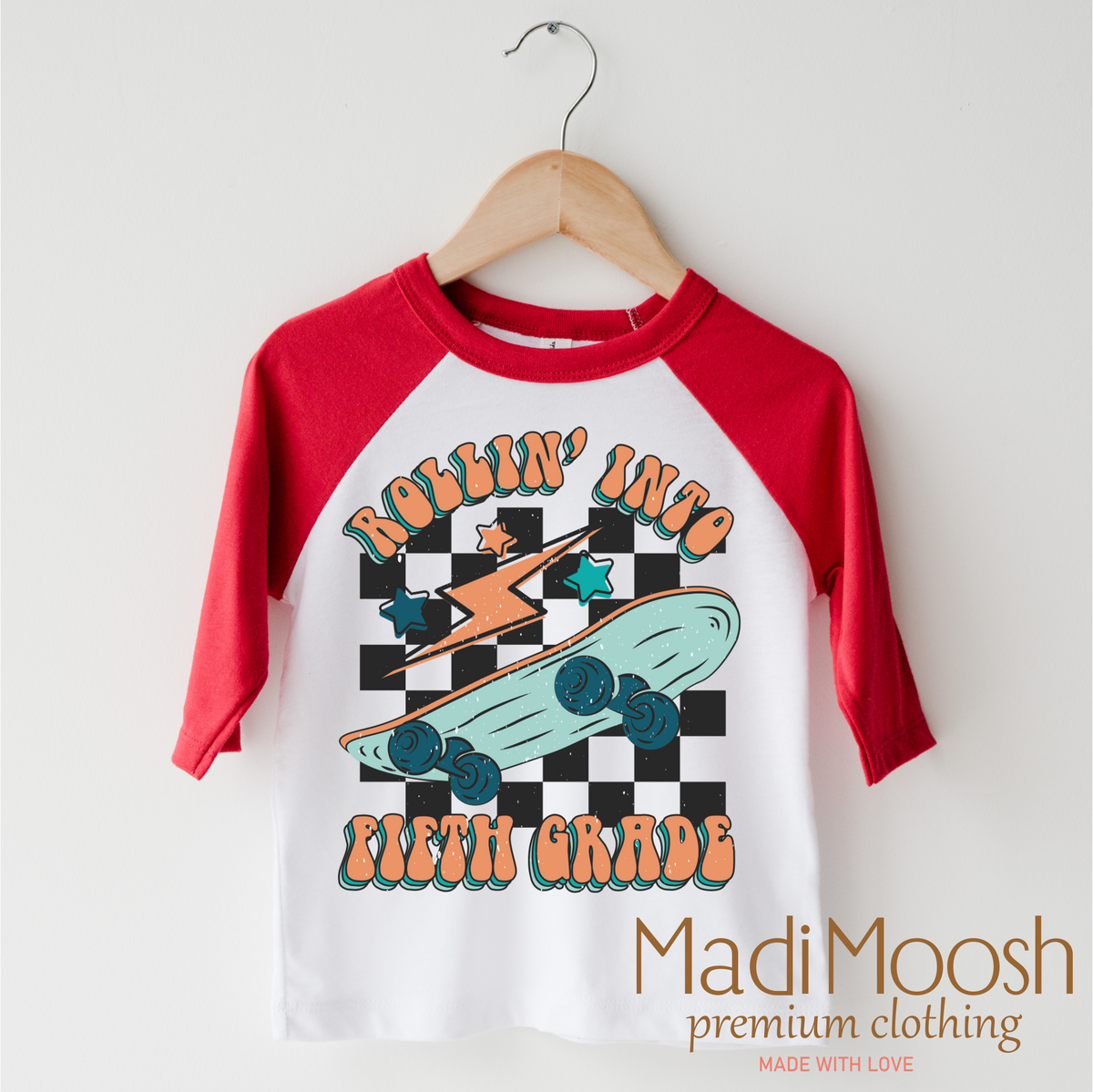 Rollin' Into 5th Back To School design on a red-accented shirt.