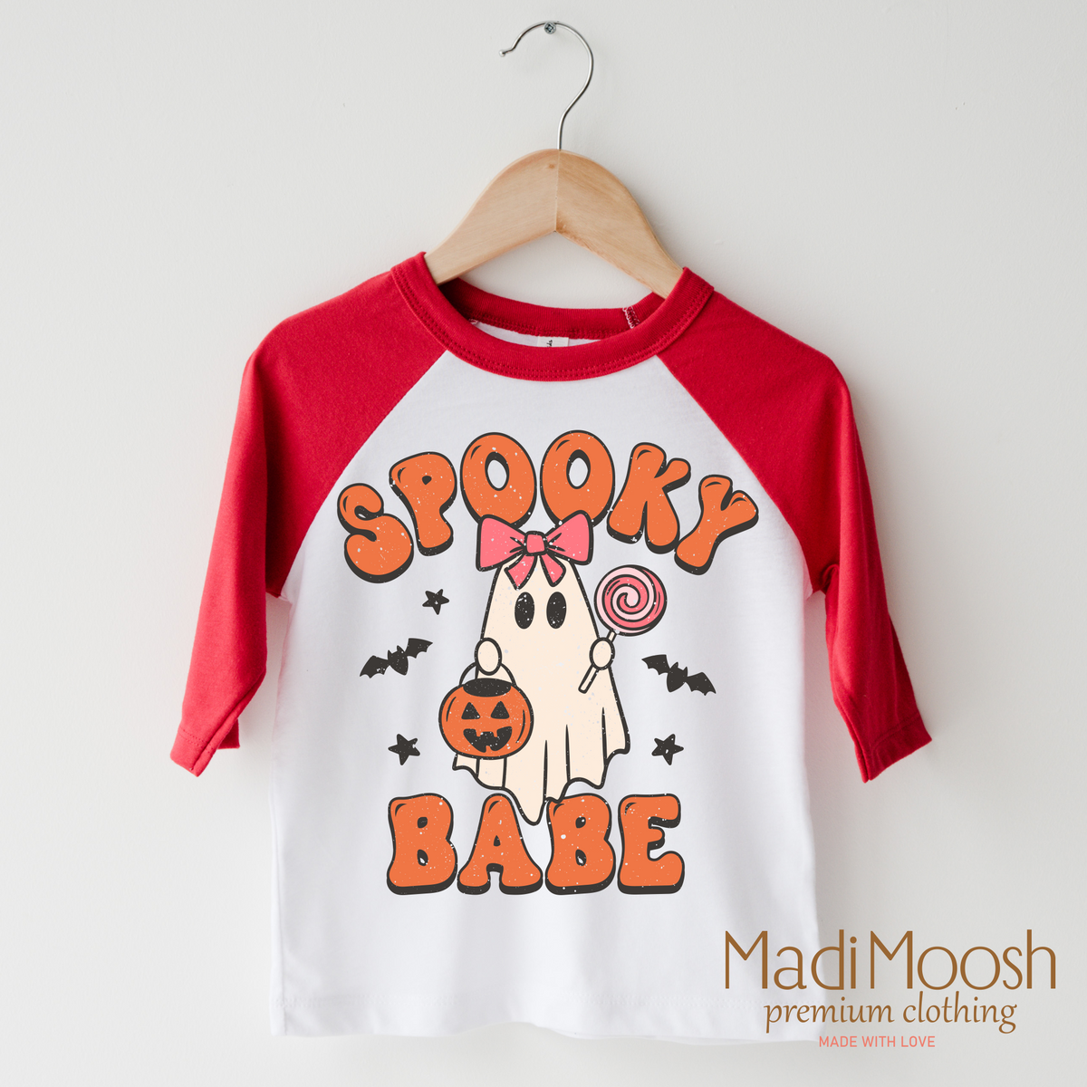 Spooky Babe design on a raglan shirt with red sleeves.