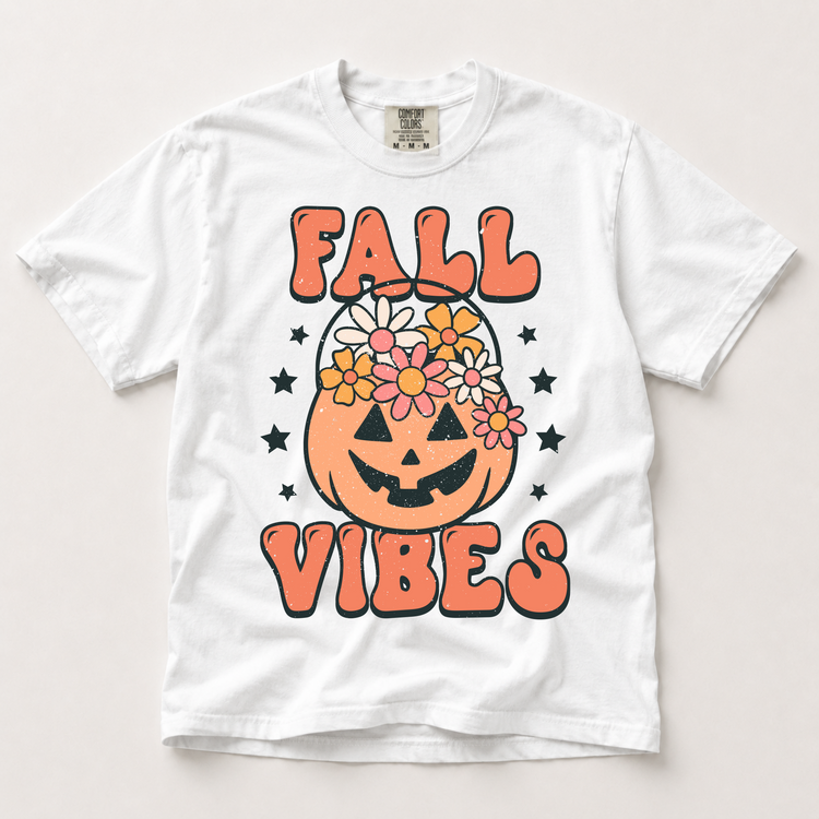Fall Vibes floral jack-o'-lantern graphic on a white Comfort Colors T-shirt