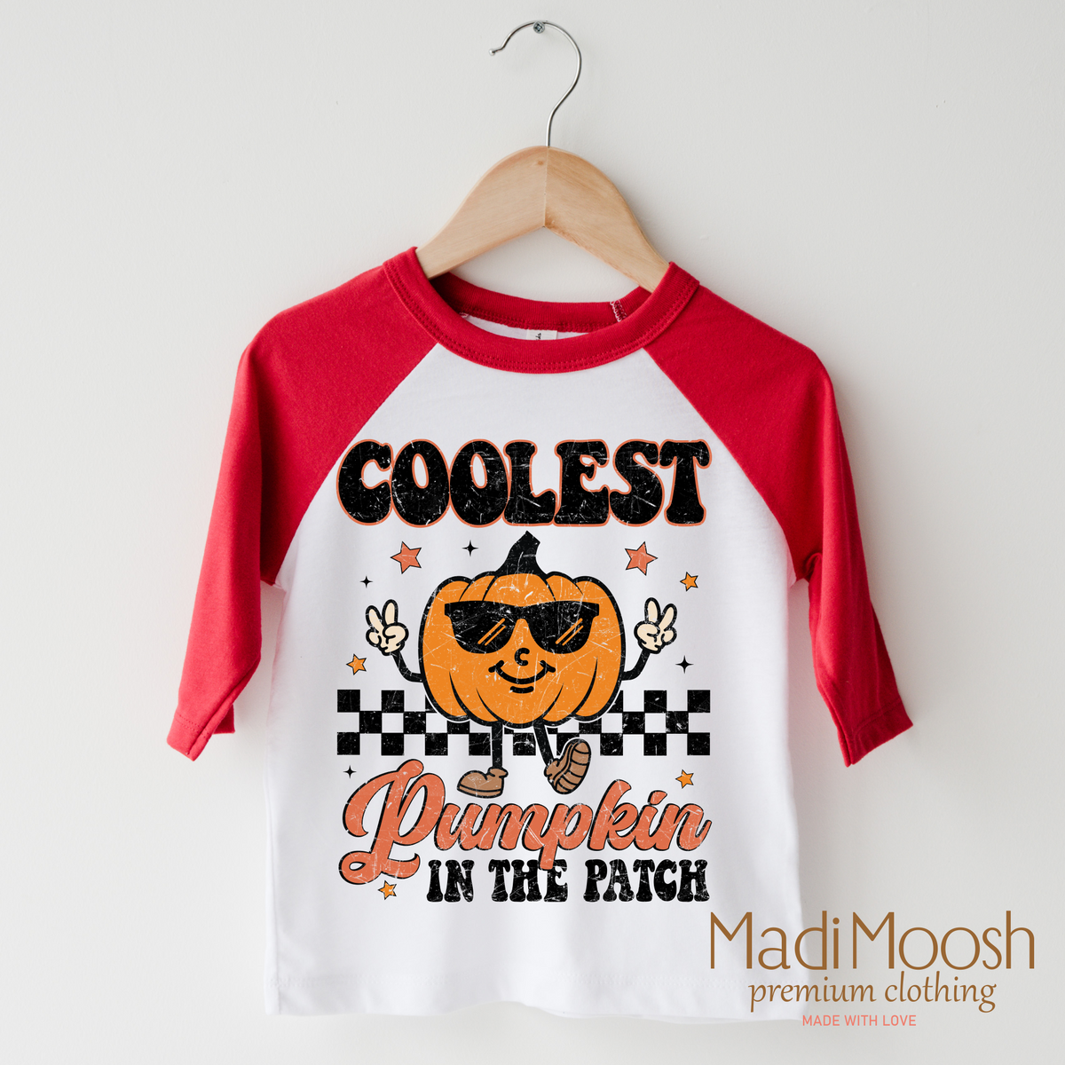 Coolest Pumpkin In The Patch Fall design on a raglan shirt with red sleeves.