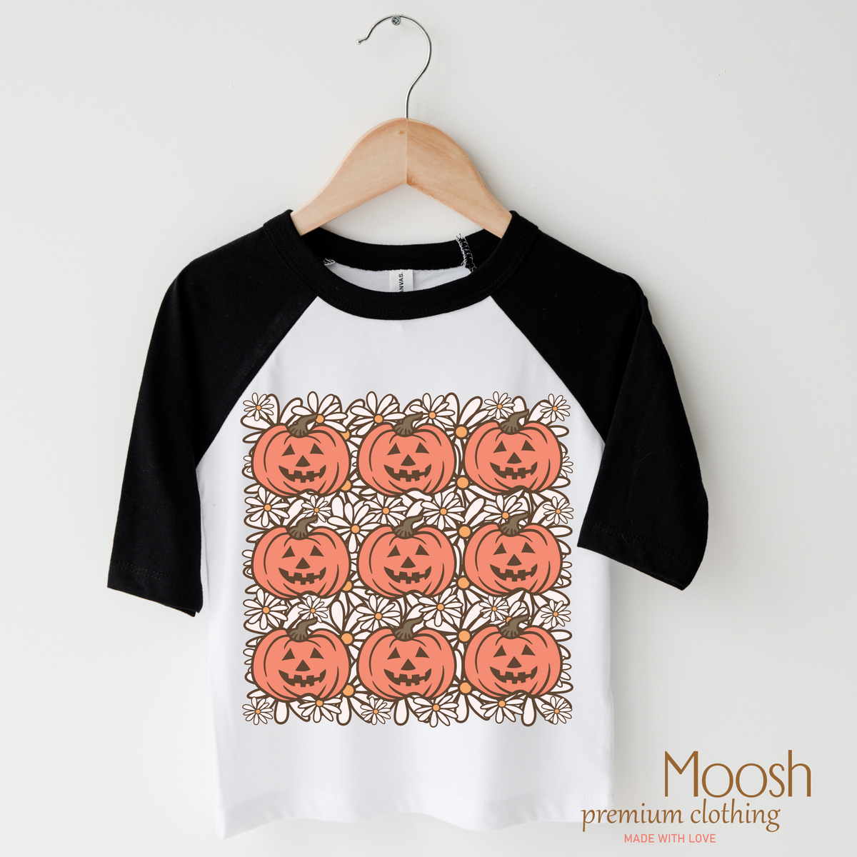 Pumpkin Season design on a raglan shirt with black sleeves.