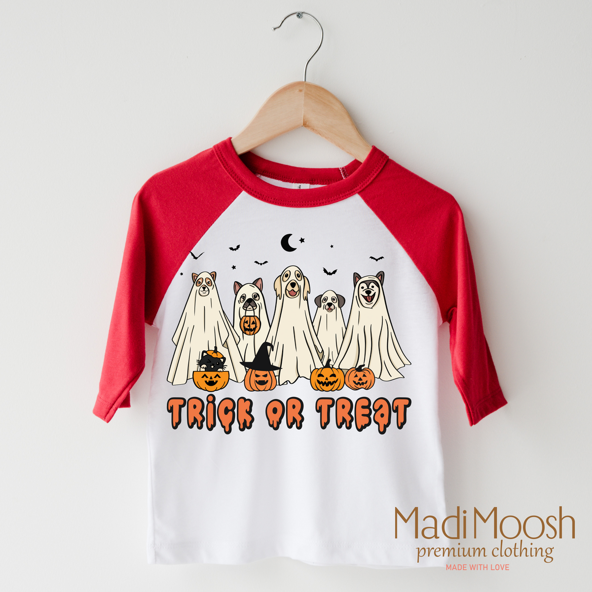Trick Or Treat Dog Ghost design on a raglan shirt with red sleeves.