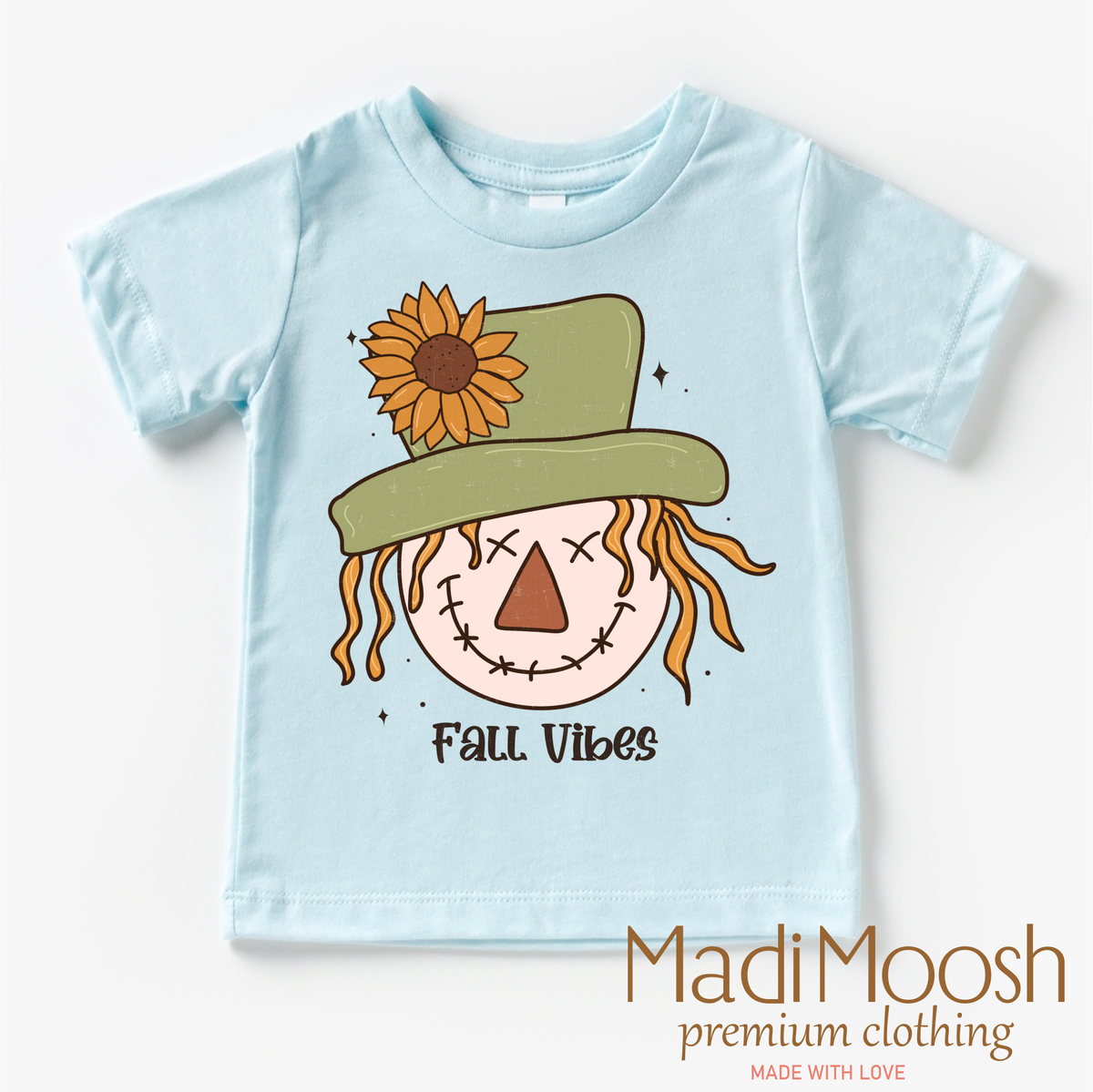 Fall Vibes Scarecrow design on a blue garment.