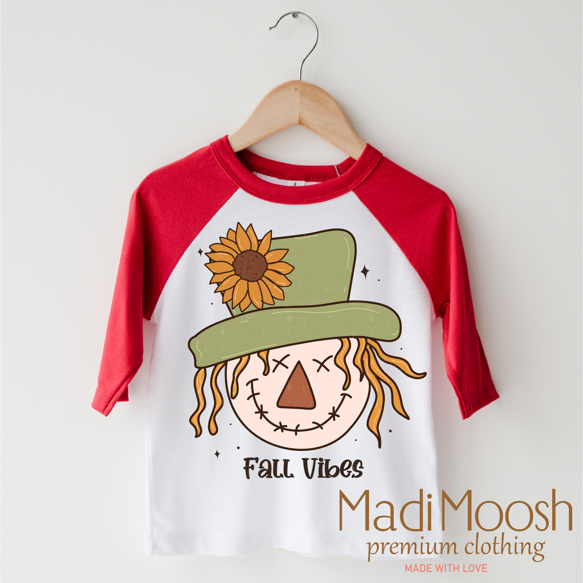 Fall Vibes Scarecrow design on a red-accented shirt.