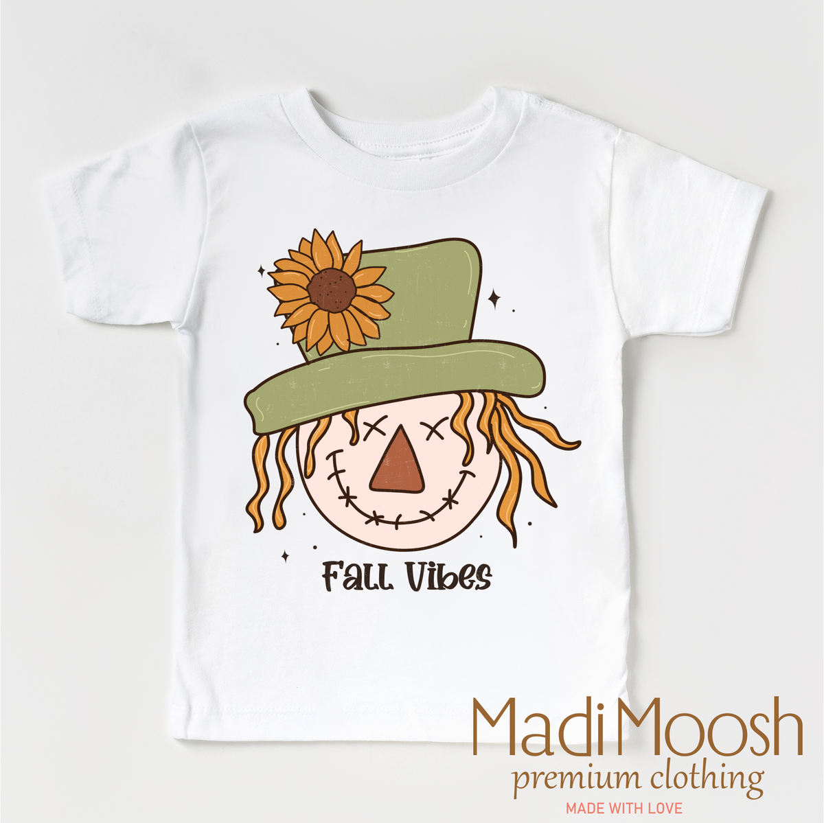 Fall Vibes Scarecrow design on a white garment.