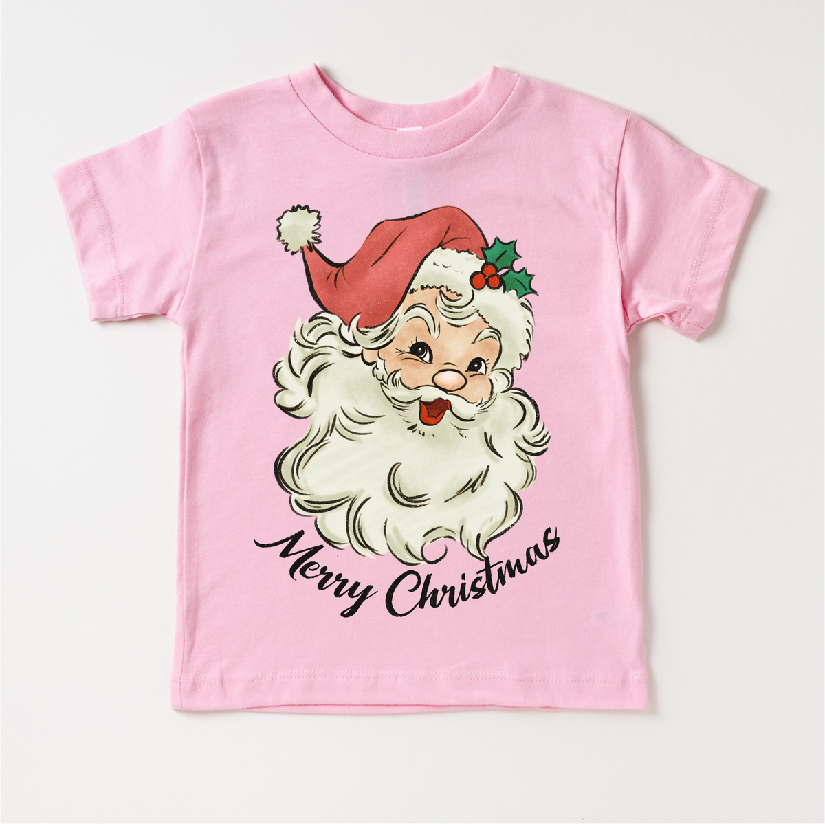 Retro Merry Christmas Santa design on a pink garment.