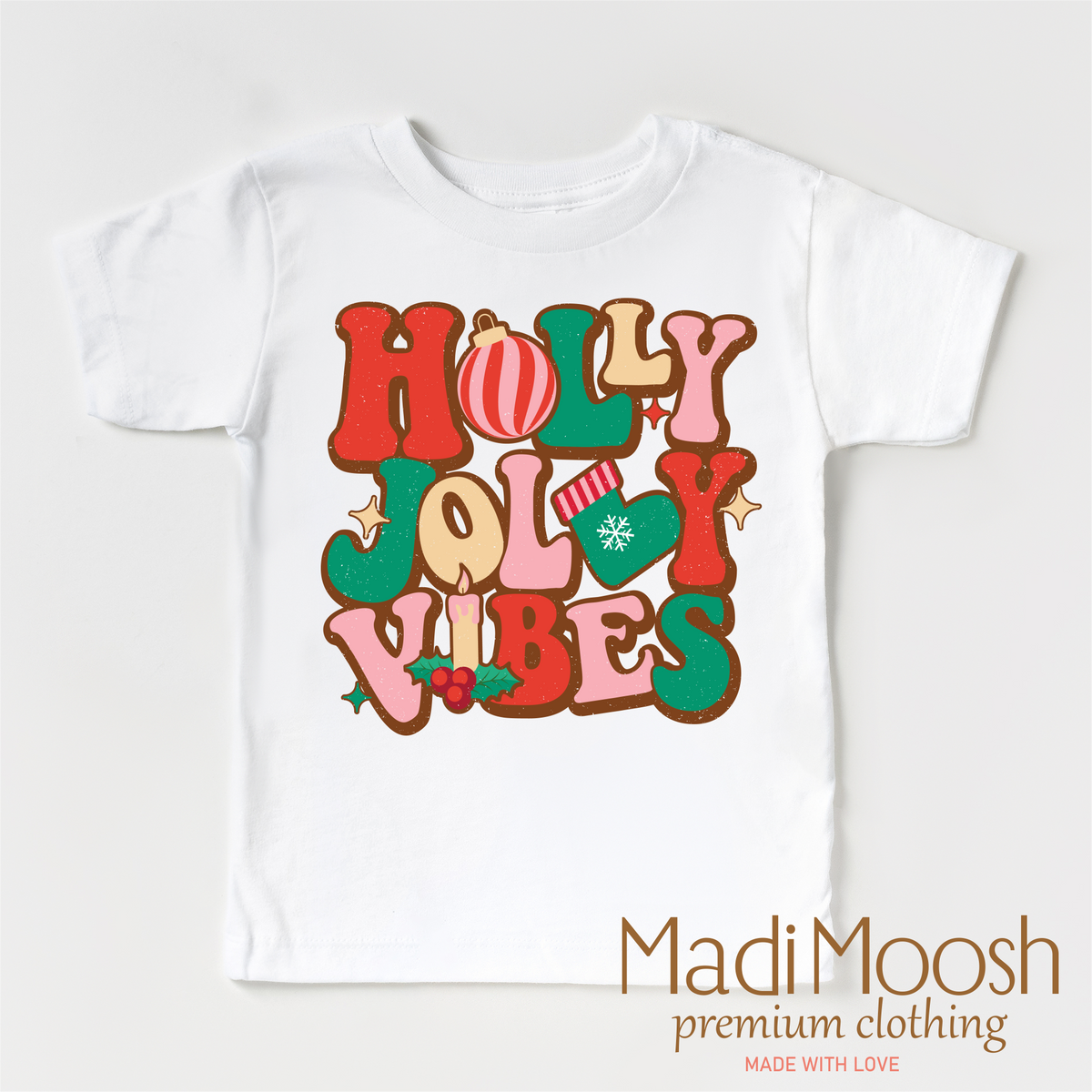 Holly Jolly Vibes design on a white short sleeve T-shirt.