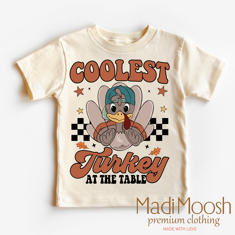 Coolest Turkey At The Table, Thanksgiving graphic T-shirt by Madi Moosh