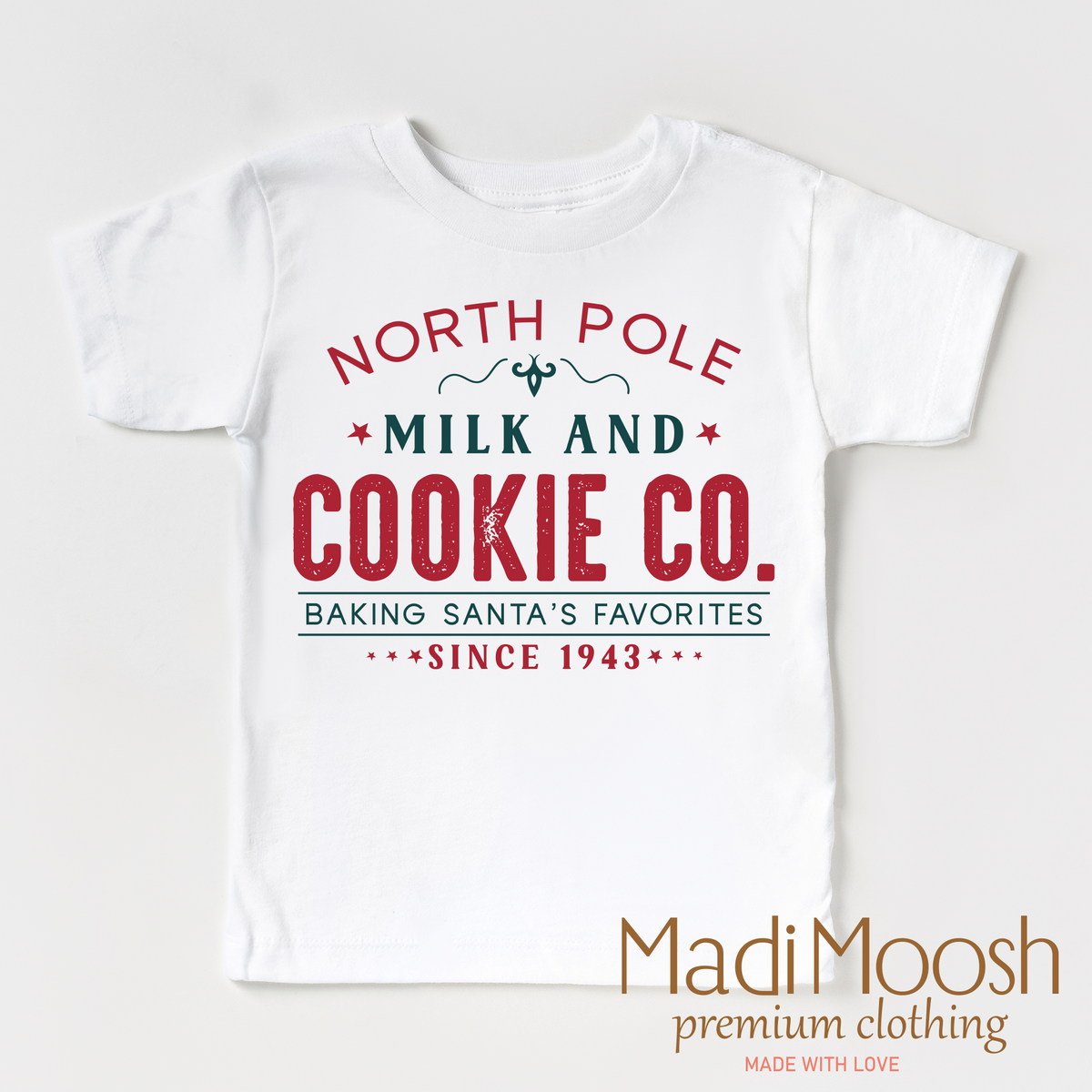 North Pole Milk and Cookie Company design on a white garment.