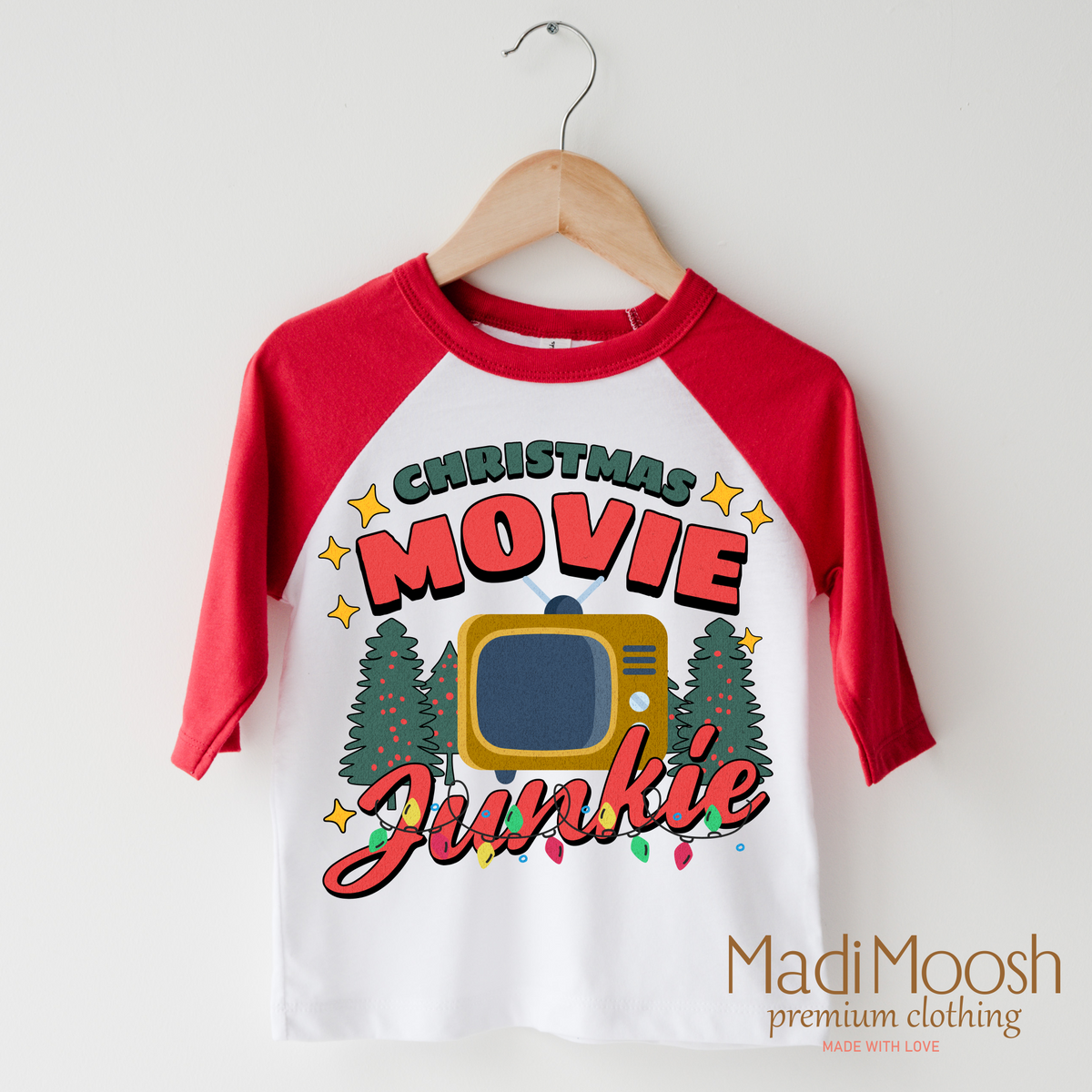 Christmas Movie Junkie design on a red-accented shirt.