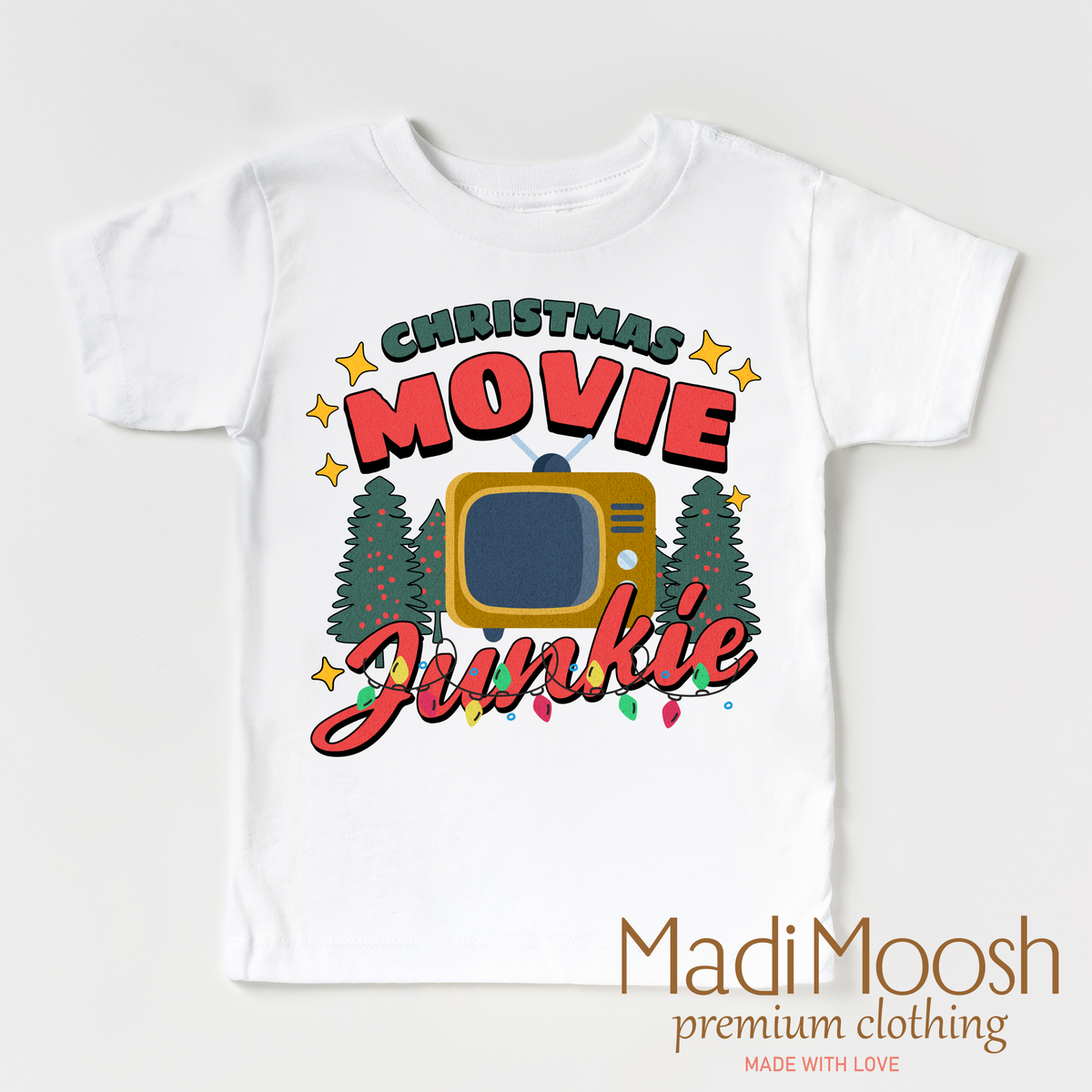 Christmas Movie Junkie design on a white garment.