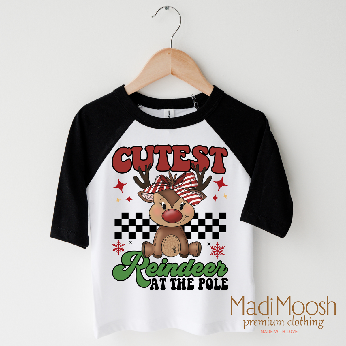 Cutest Reindeer at the Pole design on a black-accented shirt.